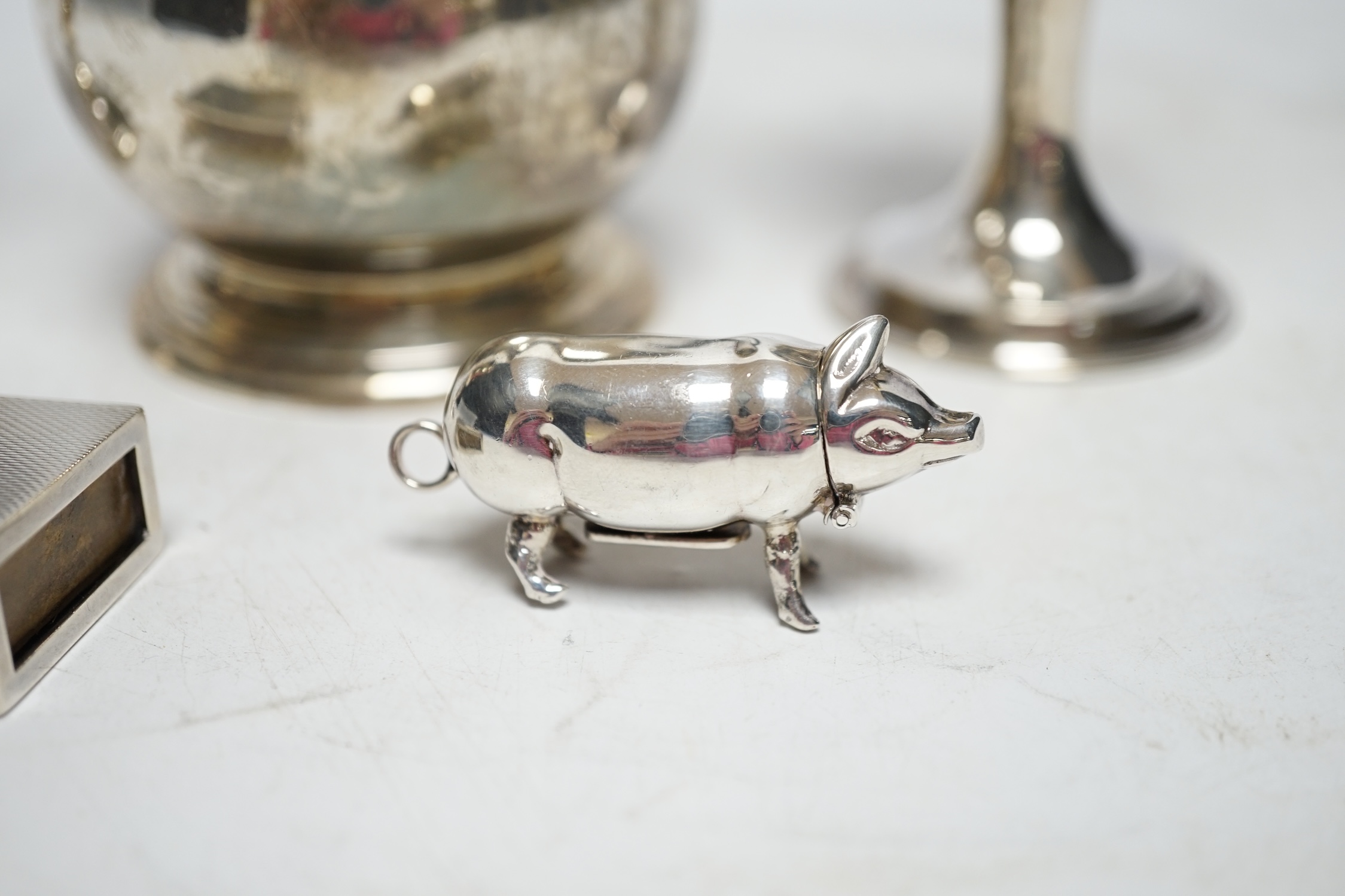 Sundry silver including a modern pig vesta case, two goblets, a match box sleeve and modern cream jug. Fair condition.